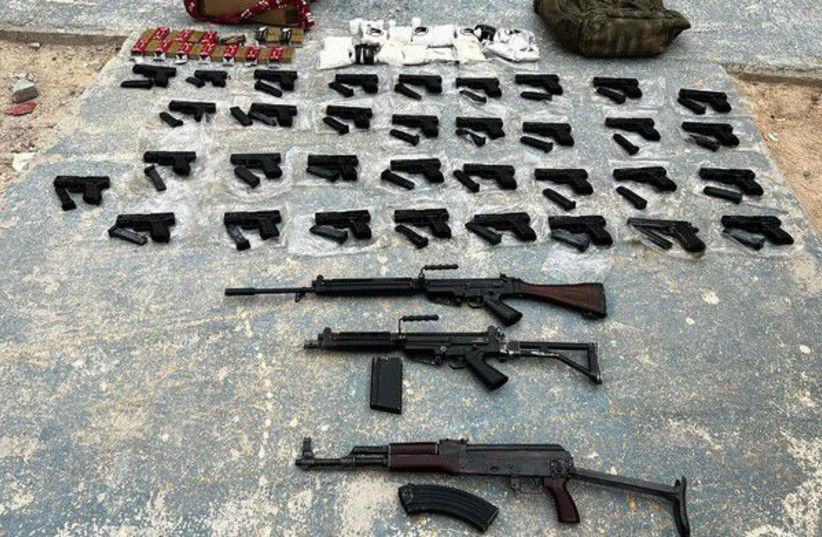  Around 300 weapons have been seized by the IDF as a result of thwarted smuggling operations along the Egyptian and Jordanian border since the start of 2022. (credit: IDF SPOKESPERSON'S UNIT)