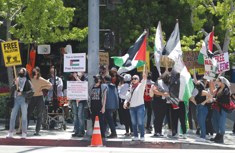  ISRAEL IS accused of genocide, at a protest outside the Israeli Consulate in Los Angeles, May 2021.  (photo credit: LUCY NICHOLSON / REUTERS)
