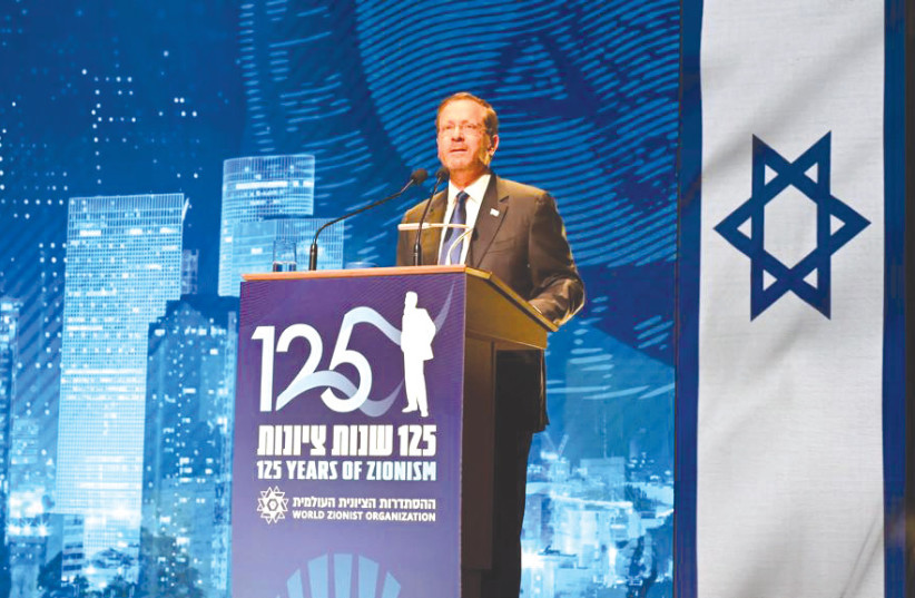  PRESIDENT ISAAC Herzog addresses the 125 Years of Zionism conference in Basel on Monday. (photo credit: HAIM ZACH/GPO)