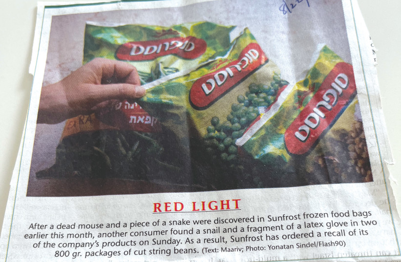  THE WRITER’S photograph shows the photo and caption that appeared in the ‘Post’ last week regarding Sunfrost frozen food. (photo credit: YONATAN SINDEL/FLASH90)