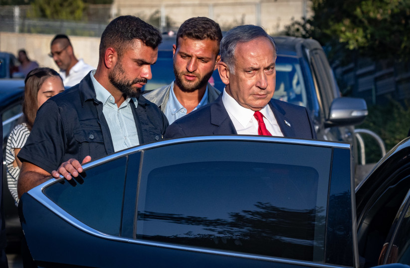  Then-opposition leader Benjamin Netanyahu seen entering a vehicle on August 29, 2022 (photo credit: OLIVIER FITOUSSI/FLASH90)