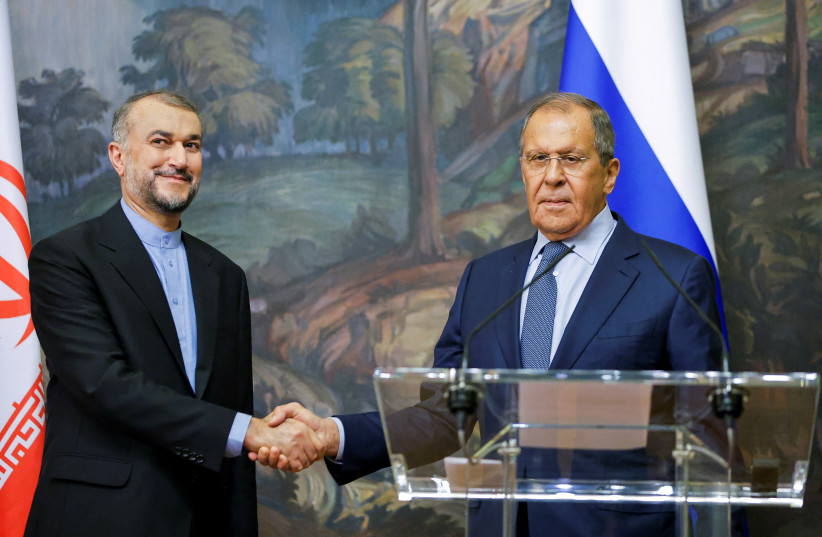 Russian Foreign Minister Sergei Lavrov shakes hands with Iranian Foreign Minister Hossein Amir-Abdollahian during a joint news conference in Moscow, Russia August 31, 2022. (photo credit: REUTERS/MAXIM SHEMETOV)