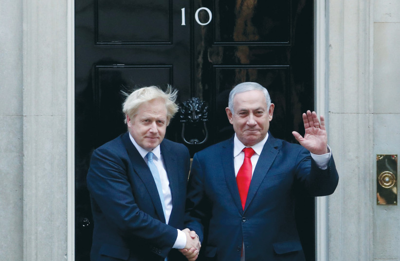  THEN-PRIME MINISTER Benjamin Netanyahu is welcomed to 10 Downing Street by Britain’s Prime Minister Boris Johnson, 2019. (photo credit: Hannah McKay/Reuters)