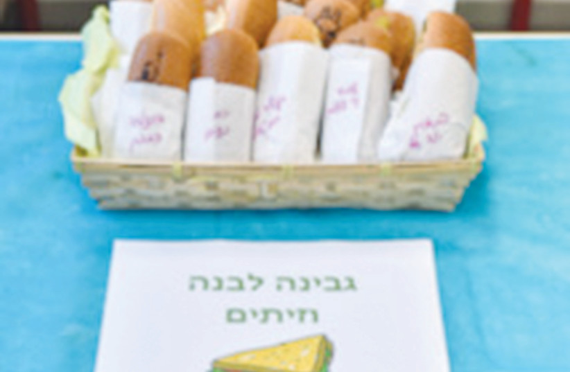  SANDWICHES ARE made in schools with ingredients provided by Nevet.  (photo credit: OMRI SHAPIRA)