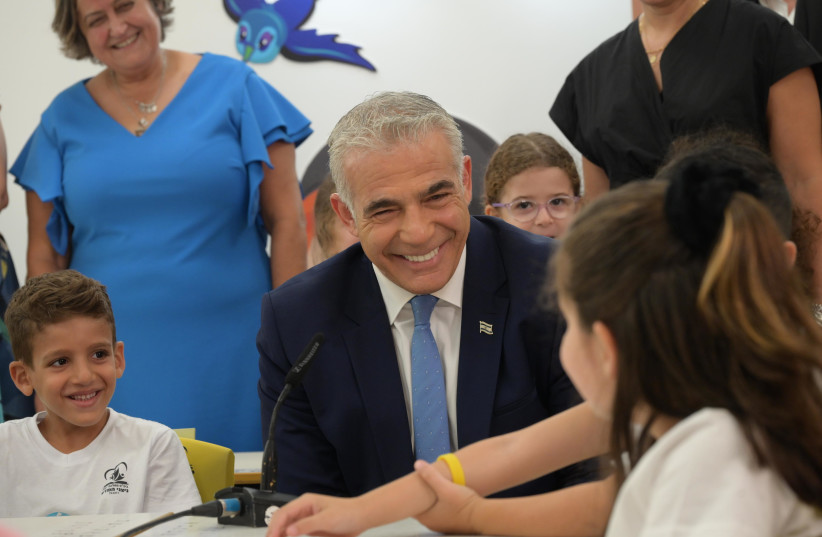  PRIME MINISTER Yair Lapid is seen visiting a Rehovot school on the first day of the new school year on September 1, 2022 (credit: AMOS BEN GERSHOM/GPO)