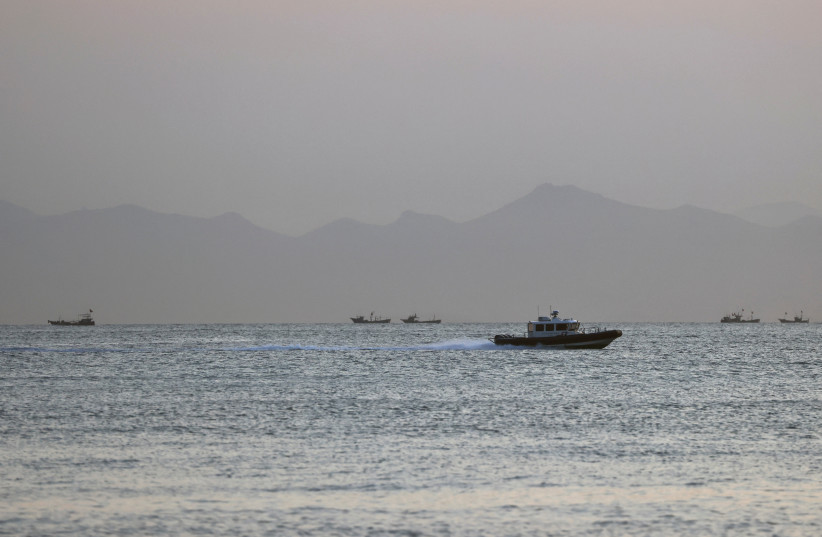  A Taiwan Coast Guard ship travels past the coast of China, in the waters off Nangan island of Matsu archipelago in Taiwan August 16, 2022.  (credit: REUTERS/ANN WANG)