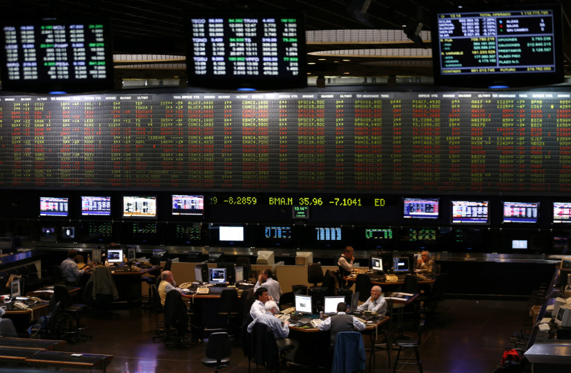 Traders work on the floor of the Buenos Aires Stock Exchange, October 2, 2014. (credit: REUTERS/MARCOS BRINDICCI)