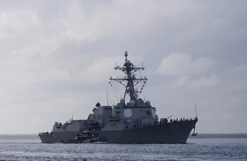 The US Navy guided-missile destroyer USS Nitze (R) and the guided-missile cruiser USS Leyte Gulf depart Naval Station Norfolk to ride out the storm in the Atlantic Ocean ahead of Hurricane Florence, in Norfolk, Virginia, September 10, 2018. (photo credit: US NAVY/MASS COMMUNICATION SPECIALIST 2ND CLASS JUSTIN WOLPERT/HANDOUT VIA REUTERS)