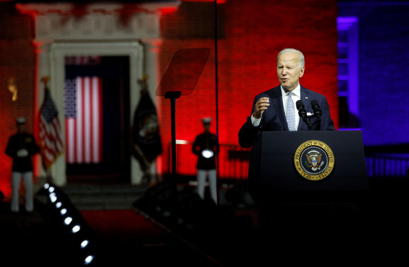 US President Joe Biden, protected by bulletproof glass, delivers remarks on what he calls the "continued battle for the Soul of the Nation" in front of Independence Hall at Independence National Historical Park, Philadelphia, US, September 1, 2022 (photo credit: REUTERS)