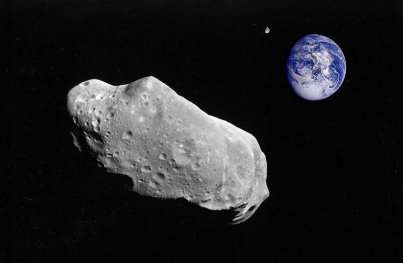  An asteroid is seen passing by the Earth in a flyby (Illustrative). (credit: PIXABAY)