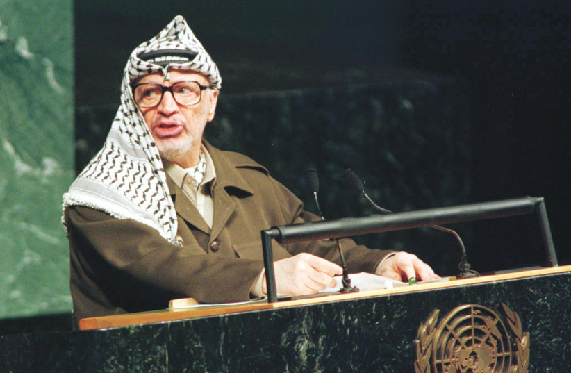  YASSER ARAFAT, founder of the Palestine Liberation Organization and at the time head of the Palestinian Authority, addresses the UN General Assembly in 1998. Two years after the Munich Massacre, in 1974, the UN first welcomed him to speak at the General Assembly. (photo credit: REUTERS)