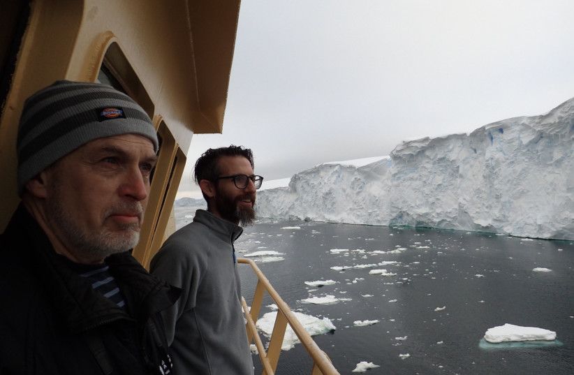 THOR scientists Alastair Graham (right) and Robert Larter (left) look on in awe at the crumbling ice face of the Thwaites Glacier margin, from the bridge deck of the R/V Nathaniel B. Palmer. (credit: FRANK NITSCHE)