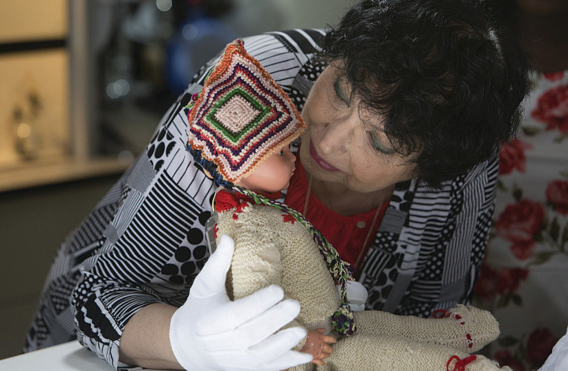  INGE AUERBACHER donates her doll, Marlene, to the United States Holocaust Memorial Museum in 2014. (photo credit: UNITED STATES HOLOCAUST MEMORIAL MUSEUM)