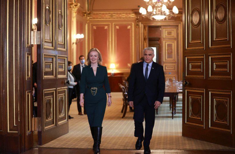 Former British Foreign Secretary Liz Truss meets with Israeli then-Foreign Minister Yair Lapid at Britain's Foreign Commonwealth & Development Office in London, Britain, November 29, 2021.  (credit: REUTERS/HANNAH MCKAY)