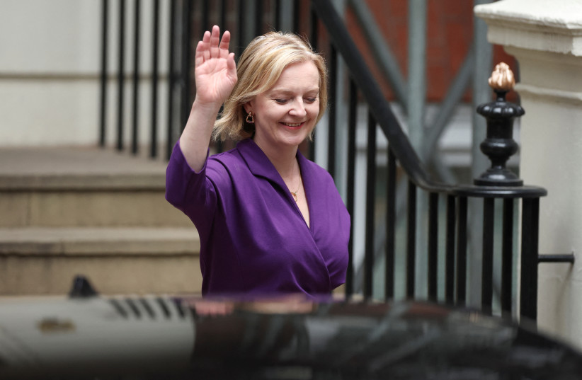  Liz Truss gestures outside the Conservative Party headquarters, after being announced as Britain's next Prime Minister, in London, Britain September 5, 2022. (credit: REUTERS/PHIL NOBLE)
