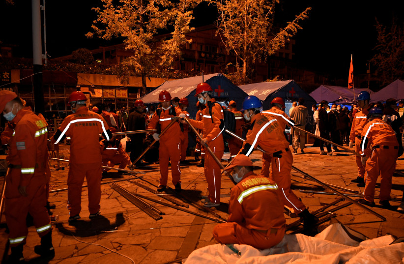  Rescue workers set up tents at a shelter following a 6.8-magnitude earthquake in Moxi town, Luding county, Ganzi Tibetan Autonomous Prefecture, Sichuan province, China September 5, 2022. (photo credit: CHINA DAILY VIA REUTERS)