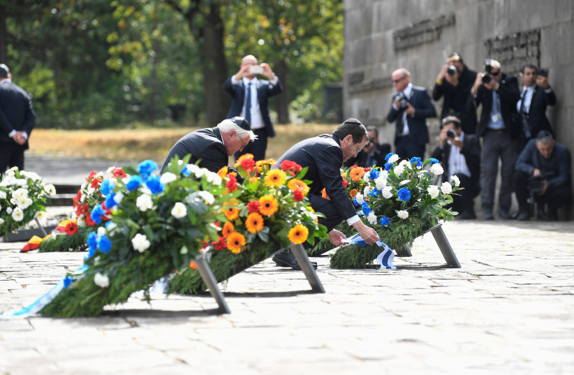  German President Frank-Walter Steinmeier and Israel's President Isaac Herzog lay a wreath at the memorial site of the former WWII concentration camp Bergen-Belsen in Lohheide, Germany, September 6, 2022.  (photo credit: FABIAN BIMMER / REUTERS)