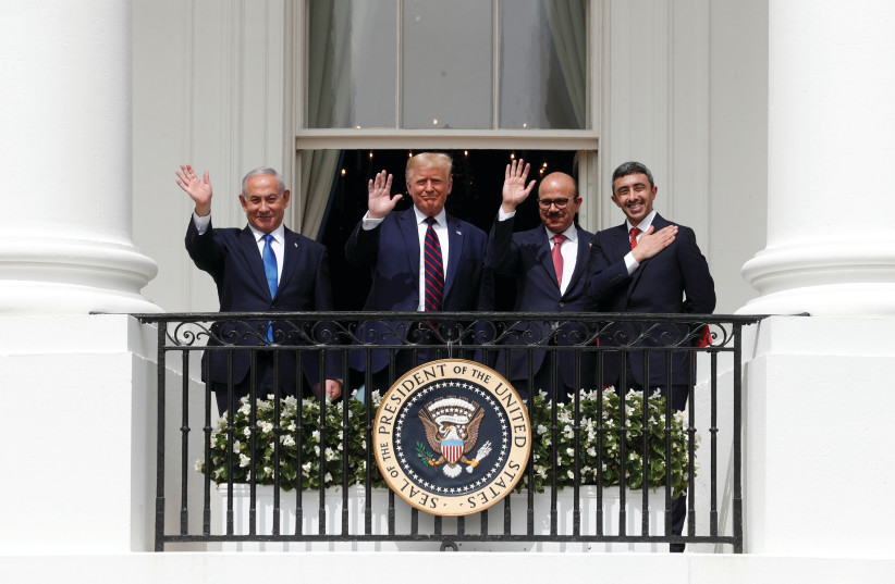 THEN-PRIME MINISTER Benjamin Netanyahu, then-US president Donald Trump, Bahrain’s Foreign Minister Abdullatif Al Zayani and UAE Foreign Minister Abdullah bin Zayed wave from the White House balcony after a signing ceremony for the Abraham Accords, September 2020. (credit: TOM BRENNER/REUTERS)