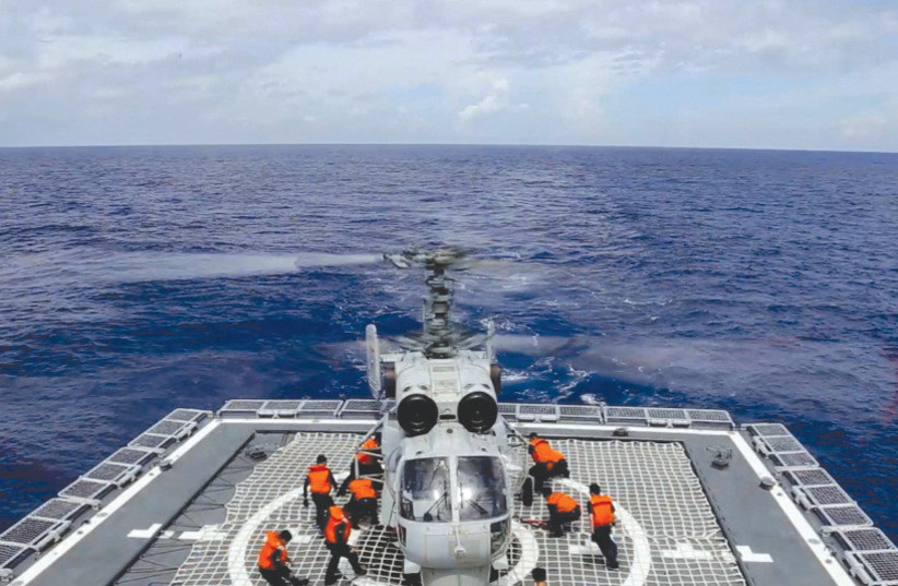  A NAVY FORCE helicopter of China’s People’s Liberation Army takes part in military exercises in the waters around Taiwan, after US Speaker Nancy Pelosi’s visit there last month. (credit: China’s Eastern Theater Command/Reuters)