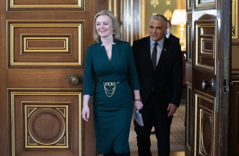 Then-UK Foreign Minister Liz Truss and Israeli Foreign Minister Yair Lapid meet at the UK Commonwealth and Development Office in London, Nov. 29, 2021. (photo credit: STEFAN ROUSSEAU/PA IMAGES VIA GETTY IMAGES)