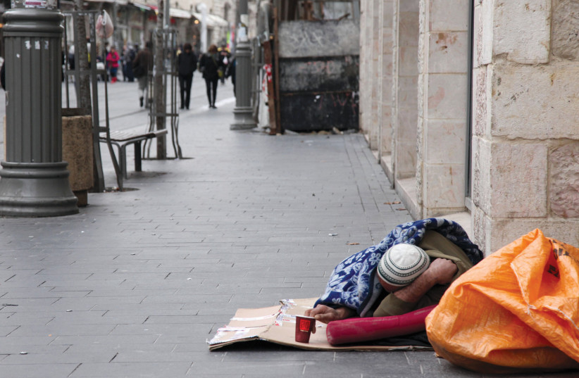  A homeless man on Jerusalem’s Jaffa Road (Illustrative photo). (photo credit: MARC ISRAEL SELLEM)