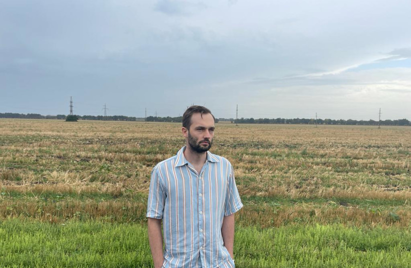  Biriuk Maksym looking over his fields, Aug. 30, 2022. (credit: Courtesy)