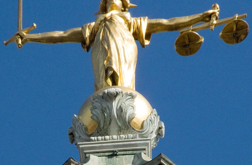  The Lady Justice statue atop London’s Old Bailey. (photo credit: WIKIPEDIA)