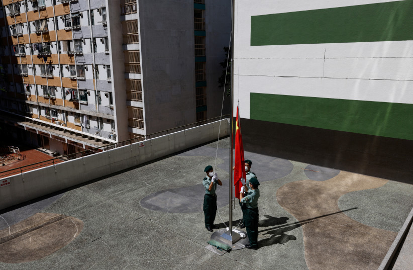Members of uniformed youth group Hong Kong Army Cadets Association perform after the first national flag raising competition in Hong Kong, China September 4, 2022. (credit: REUTERS/TYRONE SIU)
