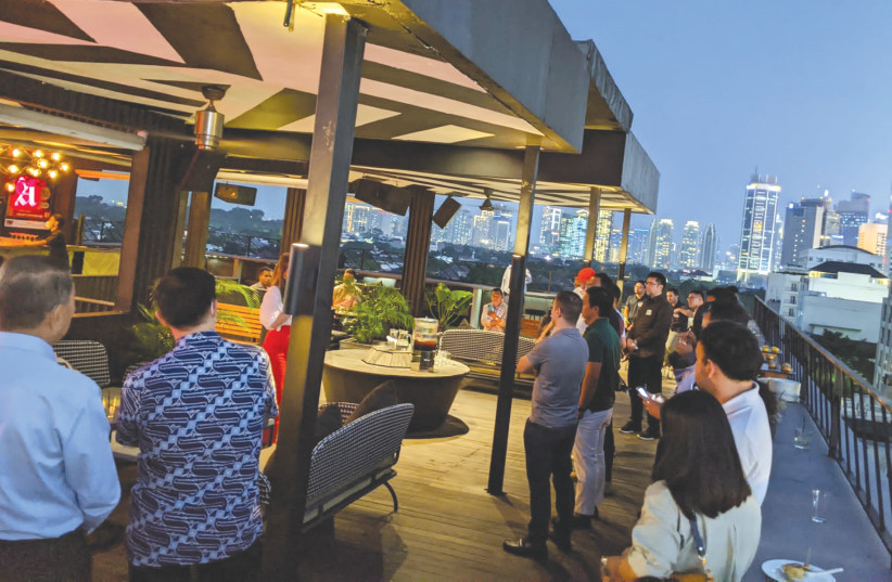 A ROOFTOP networking event is hosted by the Israel-Asia Center for members of the Israel-Indonesia Future network in Jakarta. (photo credit: SAMUEL NEUFELD)