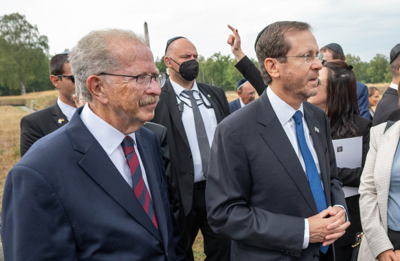  Menachem Rosensaft, left, accompanies Israeli President Isaac Herzog, right, on a visit to the Bergen Belsen concentration camp, September 6, 2022 (photo credit: SHAHAR AZRAN/WJC VIA JTA)