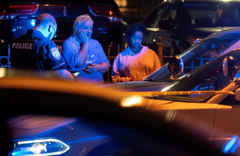  Memphis police officers work at one of multiple crime scenes they believe were committed by a man driving around shooting in Memphis, Tennessee, U.S. September 7, 2022. (photo credit: Christine Tannous/USA Today Network via REUTERS)
