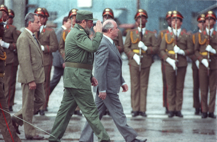  SOVIET LEADER Mikhail Gorbachev and Cuban President Fidel Castro review the troops during welcoming ceremonies at Jose Marti Airport in Havana, April 2, 1989.  (photo credit: REUTERS)