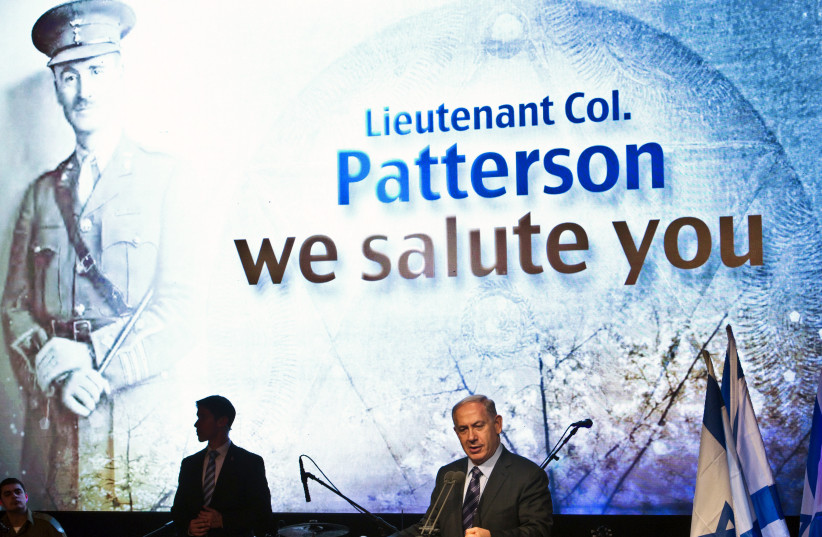  Prime Minister Benjamin Netanyahu speaks at a reinterment ceremony for John Henry Patterson near Netanya in 2014. He was a British commander of the Jewish Legion during World War I, and his ashes were reburied in Israel. (photo credit: NIR ELIAS/REUTERS)