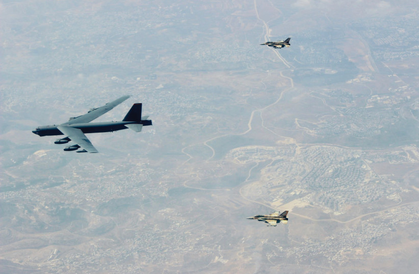  TWO ISRAELI Air Force F-16I fighter jets accompany a US B-52 bomber over Israel as it makes its way to the Gulf. (photo credit: IDF)