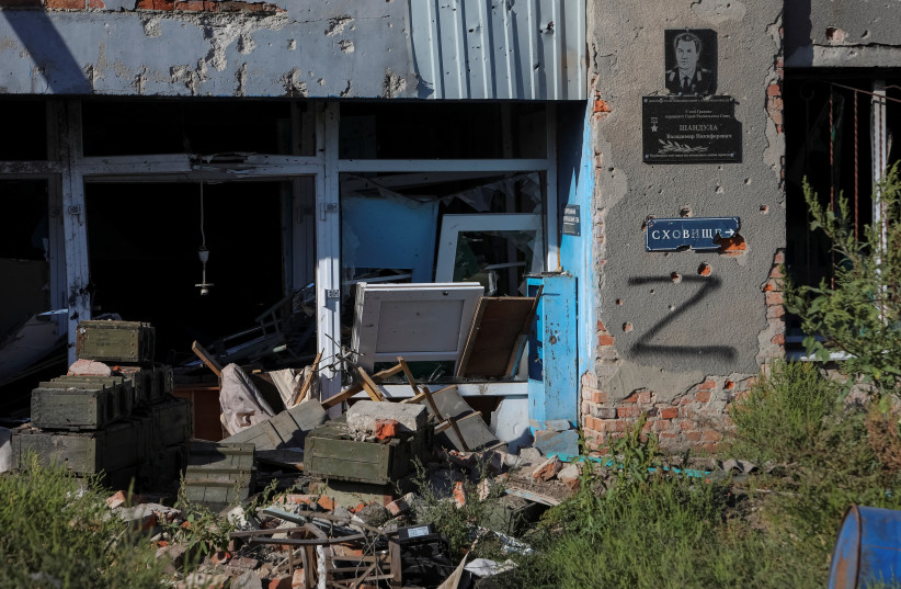  An ammunition boxes are seen near a house damaged by shelling, as Russia's attack on Ukraine continues, in the village of Hrakove, recently liberated by Ukrainian Armed Forces, in Kharkiv region, Ukraine September 9, 2022 (photo credit: REUTERS/VYACHESLAV MADIYEVSKYY)
