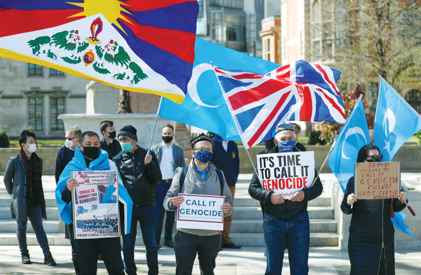  A protest against Uighur genocide takes place in London, last year. (photo credit: PETER NICHOLLS/REUTERS)