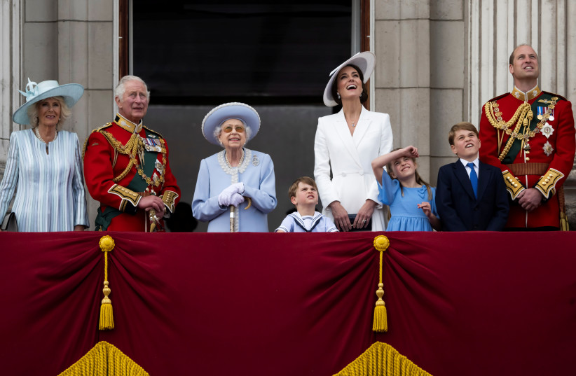 The Queen along with members of the Royal Family watches the special flypast by Britain's RAF (Royal Air Force) from Buckingham Palace balcony following the Trooping the Colour parade, as a part of her platinum jubilee celebrations, in London, Britain June 2, 2022. (photo credit: PAUL GROVER/POOL VIA REUTERS)