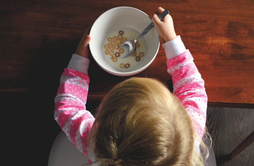  Child eating breakfast (illustrative) (photo credit: PXHERE)
