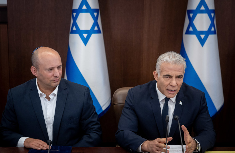  Israeli Prime Minister Yair Lapid with Alternate Prime Minister Naftali Bennett at a cabinet meeting at the Prime Minister's Office in Jerusalem on September 11, 2022. (credit: YONATAN SINDEL/FLASH90)