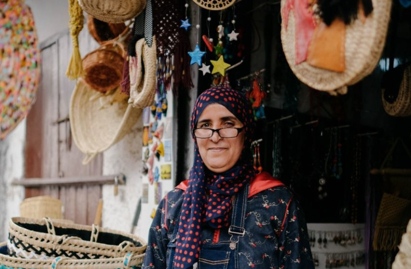 A Moroccan Muslim woman displays her wares in the mellah.  (photo credit: COURTESY/HICHAM ESSAIDI)