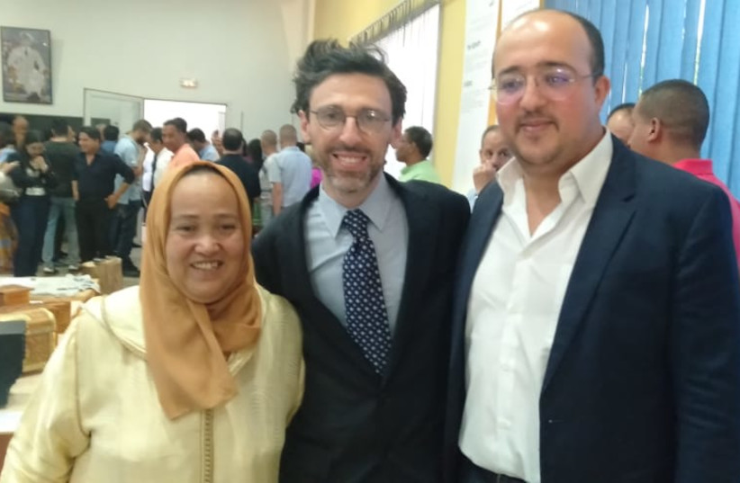  From right, El Mehdi Boudra, founder/president Mimouna Association; Jason Guberman, executive director, American Sephardi Federation; and Moroccan artist Amina Yabis at the Rebuilding Our Homes exhibit opening at the Mohammed V Foundation in Fez. (credit: Courtesy)