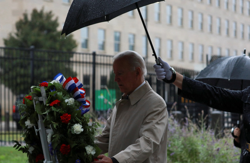 US President Joe Biden lays a wreath during a ceremony to honor victims of the September 11, 2001, attacks at the Pentagon in Washington, US, September 11, 2022 (credit: CHERISS MAY/REUTERS)