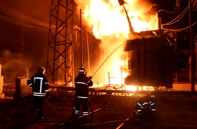 Firefighters work at a site of a thermal power plant damaged by a Russian missile strike, amid Russia's attack on Ukraine, in Kharkiv, Ukraine, September 11, 2022. (photo credit: Press service of the State Emergency Service of Ukraine/Handout via REUTERS)