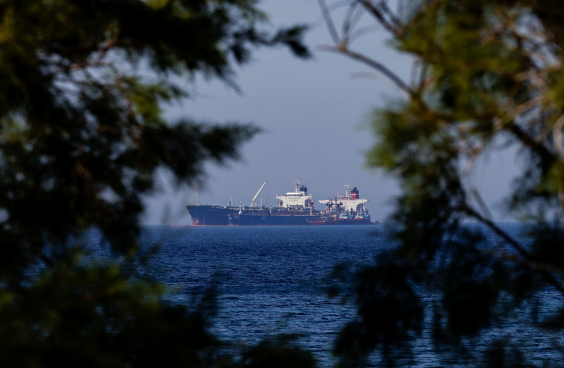  The Liberian-flagged oil tanker Ice Energy transfers crude oil from the Iranian-flagged oil tanker Lana (former Pegas), off the shore of Karystos, on the Island of Evia, Greece, May 26, 2022.  (photo credit: REUTERS/COSTAS BALTAS)