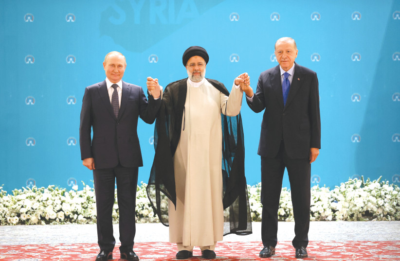  RUSSIAN PRESIDENT Vladimir Putin, Iranian President Ebrahim Raisi and Turkish President Recep Tayyip Erdogan pose for a picture before meeting in Tehran, in July (photo credit: SPUTNIK/REUTERS)