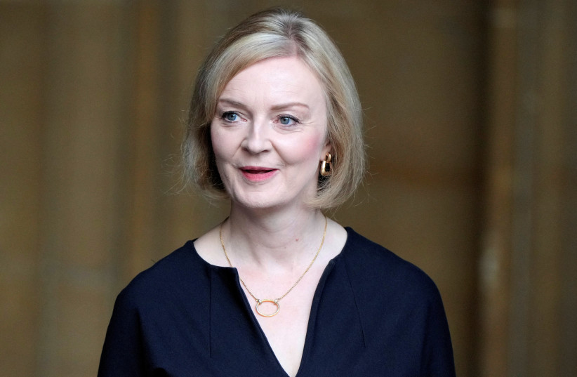 Britain's Prime Minister Liz Truss leaves after attending the presentation of addresses by both Houses of Parliament in Westminster Hall, inside the Palace of Westminster, following the death of Britain's Queen Elizabeth, in central London, Britain, September 12, 2022. (photo credit: MARKUS SCHREIBER/POOL VIA REUTERS)