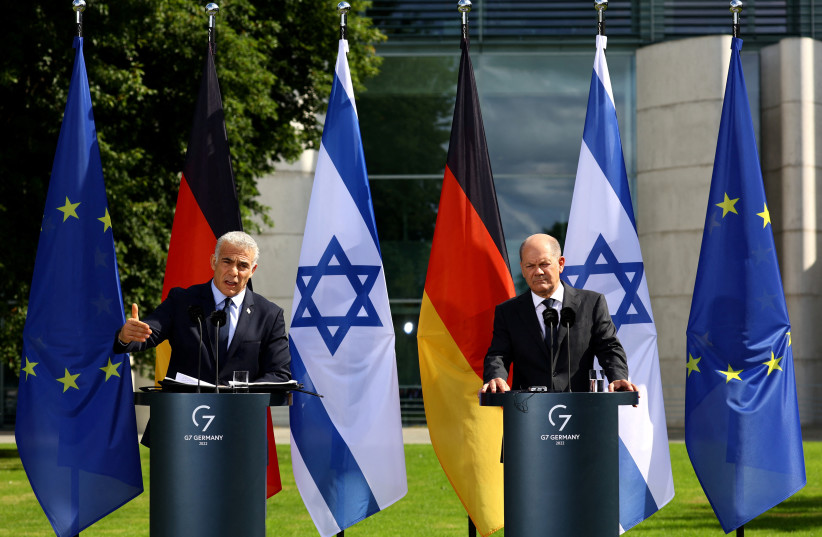 Israeli Prime Minister Yair Lapid and German Chancellor Olaf Scholz address the media at the Chancellery in Berlin, Germany, September 12, 2022. (credit: REUTERS/CHRISTIAN MANG)