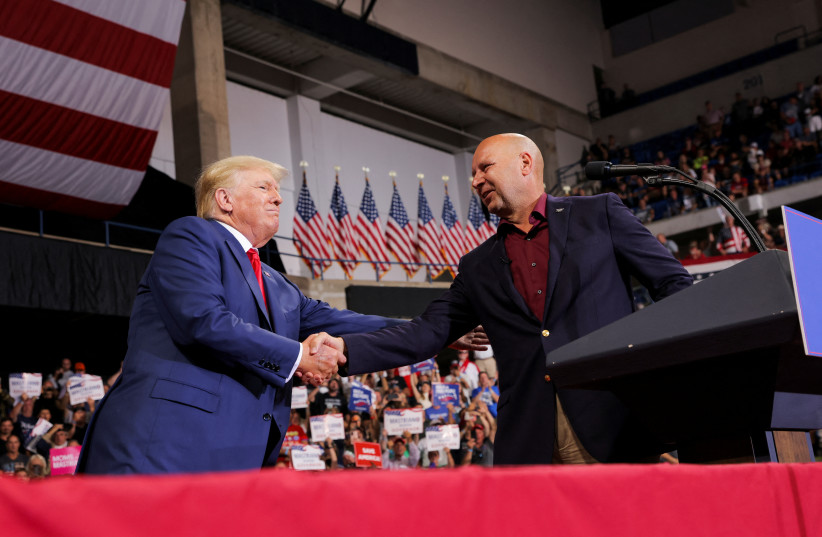 Former US president Donald Trump and Republican Pennsylvania governor candidate Doug Mastriano shake hands during a rally in Wilkes-Barre, Pennsylvania, US, September 3, 2022. (photo credit: REUTERS/ANDREW KELLY)
