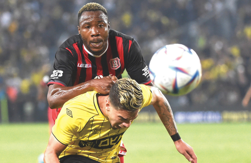  HAPOEL JERUSALEM (in red) was the better squad all around on Monday night against Beitar Jerusalem, winning the Israel Premier League derby 1-0 at Teddy Stadium (photo credit: BERNEY ARDOV)