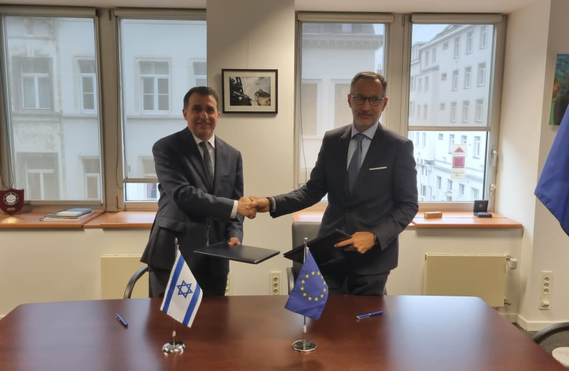  Israeli Ambassador to the EU Haim Regev and his European counterpart sign an intelligence sharing agreement on September 14, 2022 (photo credit: ISRAEL POLICE)